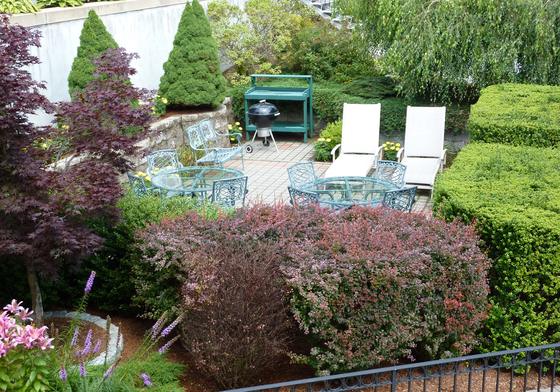 Garden patio and landscaped grounds at J.E. Waltham